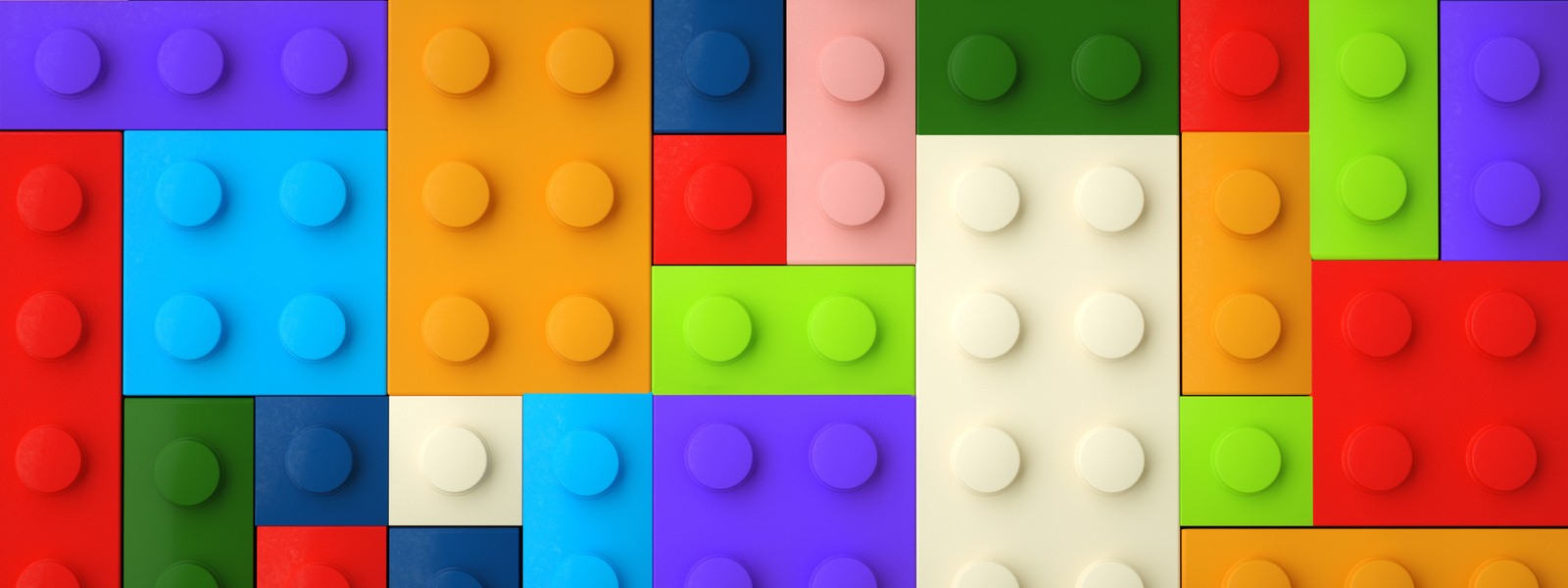 Background with colored toy bricks panoramic