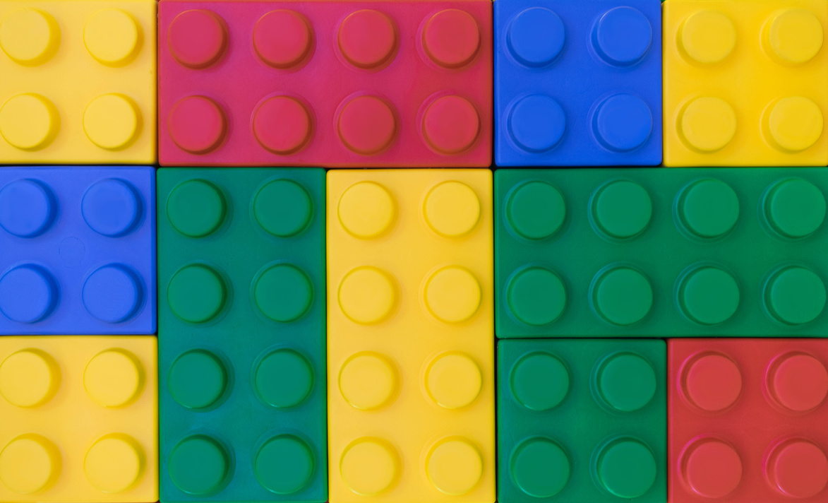 Colorful background of plastic block toy in random pattern